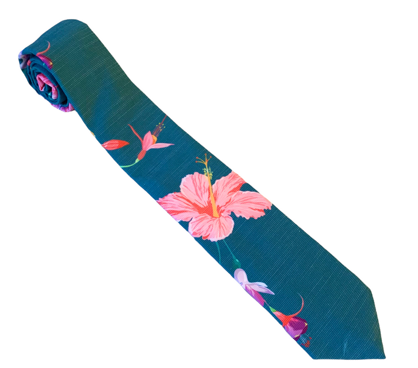 A teal necktie with tropical floral pattern, Tie for men in Cache Valley – refined Utah style made by Kator Shop for the perfect finishing touch.