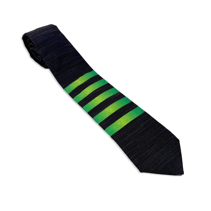 A striped green men's necktie with the pattern of water ripples in the stripes Tie from Kator Shop in Logan, Utah – high-quality men’s accessory made for timeless style and confidence.