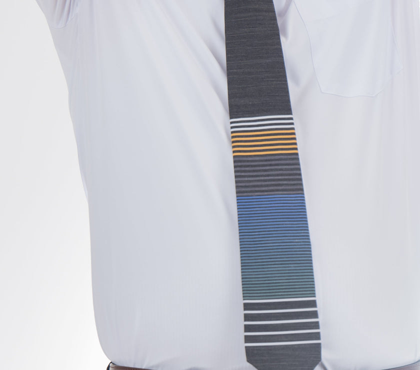 An LDS missionary man wearing a cool, modern, striped blue and yellow necktie, Tie designed in Cache Valley, Utah – sophisticated men’s style from Kator Shop’s premium collection.