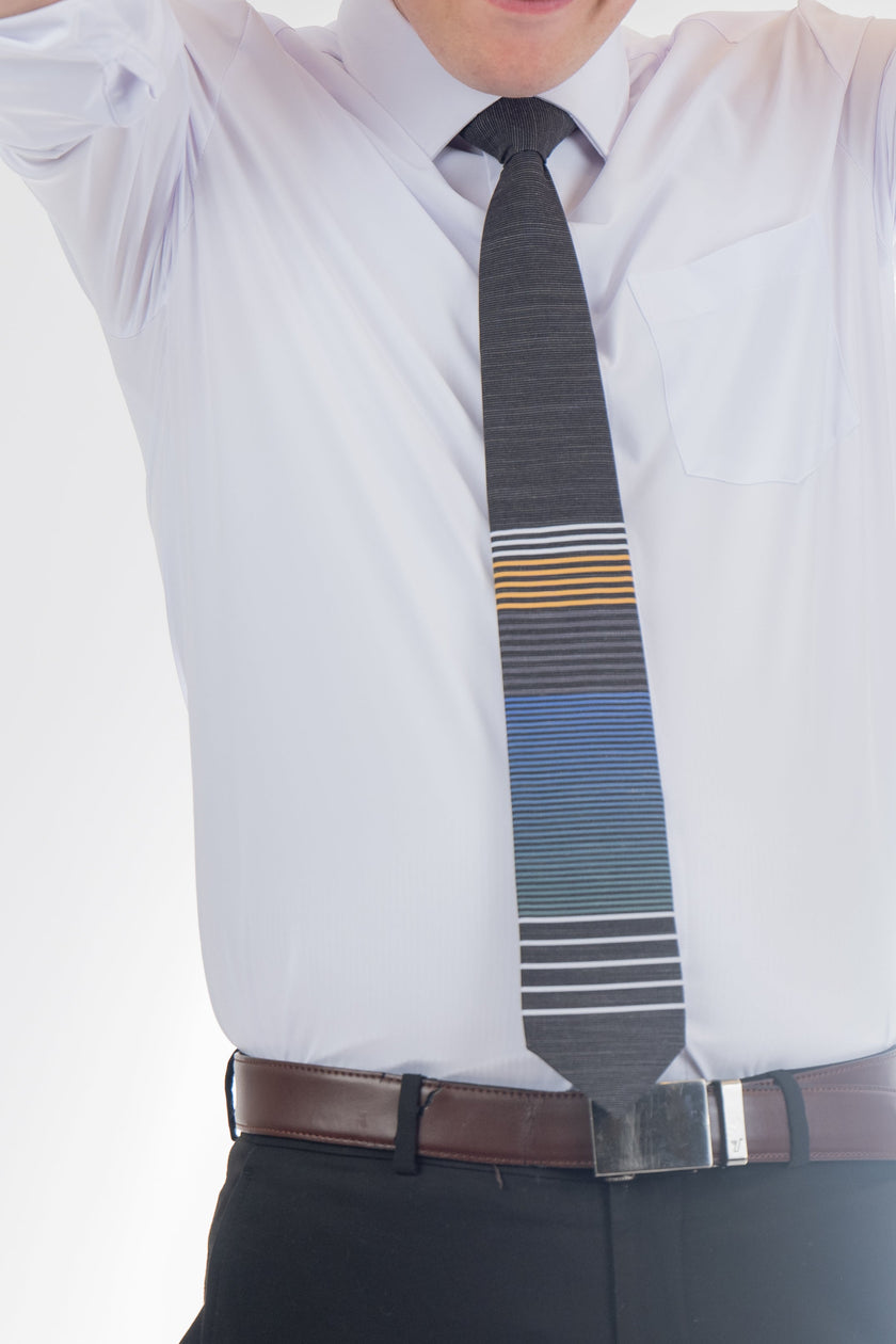 An LDS missionary man wearing a cool, modern, striped blue and yellow necktie, Tie designed in Cache Valley, Utah – sophisticated men’s style from Kator Shop’s premium collection.