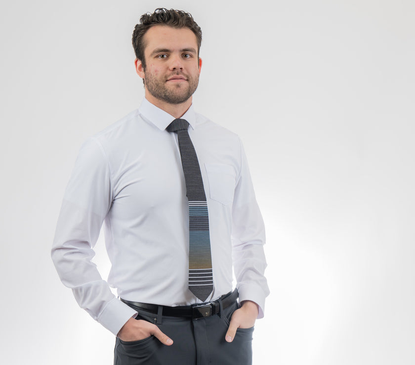 A man wearing a cool, modern, striped blue and yellow necktie