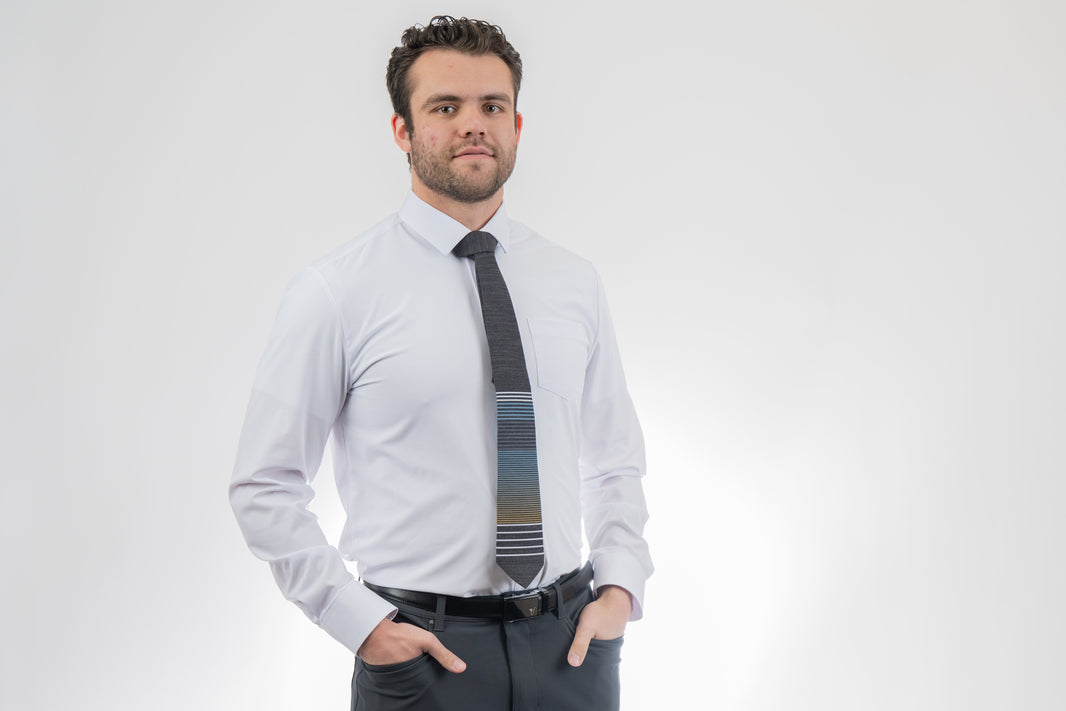 A man wearing a cool, modern, striped blue and yellow necktie