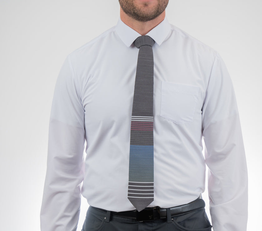 Man wearing a modern, cool, striped necktie, Formal tie from Kator Shop Logan — refined Utah design for galas, ceremonies, and special occasions.