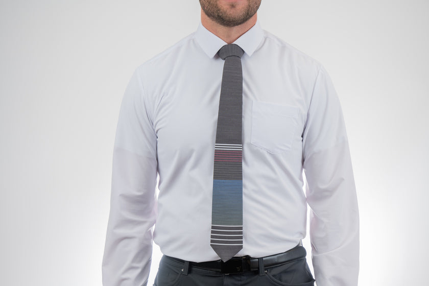 Man wearing a modern, cool, striped necktie, Formal tie from Kator Shop Logan — refined Utah design for galas, ceremonies, and special occasions.