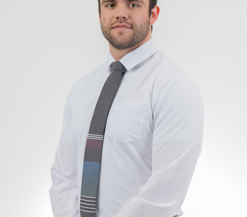 Man wearing a modern, cool, striped necktie