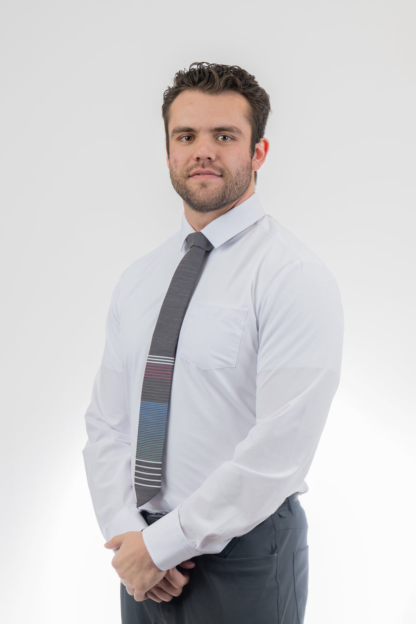 Man wearing a modern, cool, striped necktie Premium tie from Kator Shop in Cache Valley — thoughtful Utah gift for birthdays, missions, or holidays.