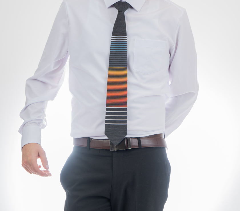 Man wearing a cool, modern, horizontal striped necktie Tie crafted for durability and class – Kator Shop Logan’s signature accessory for modern Utah men.