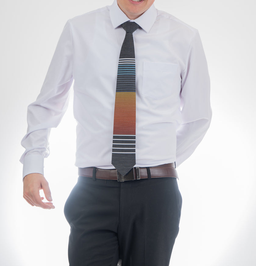 Man wearing a cool, modern, horizontal striped necktie Tie crafted for durability and class – Kator Shop Logan’s signature accessory for modern Utah men.