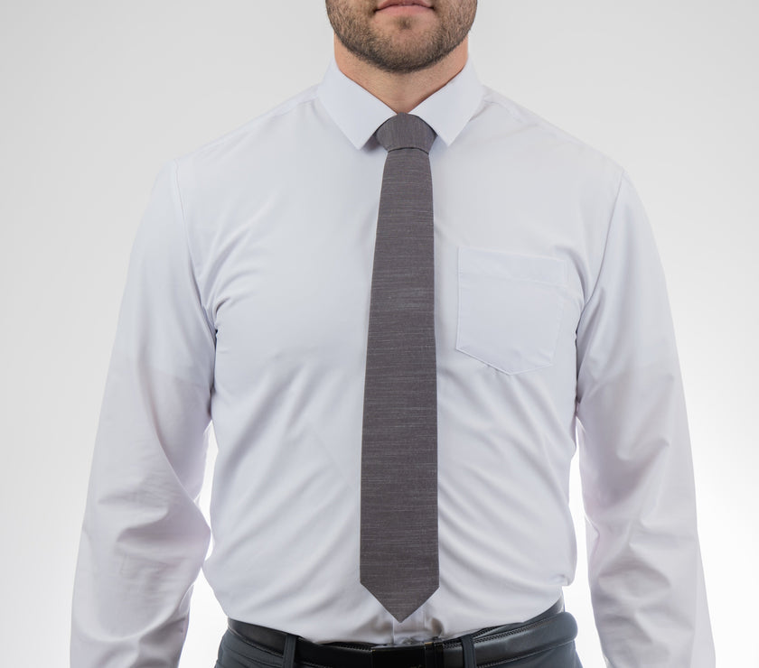 Man wearing a cool, modern, charcoal gray necktie