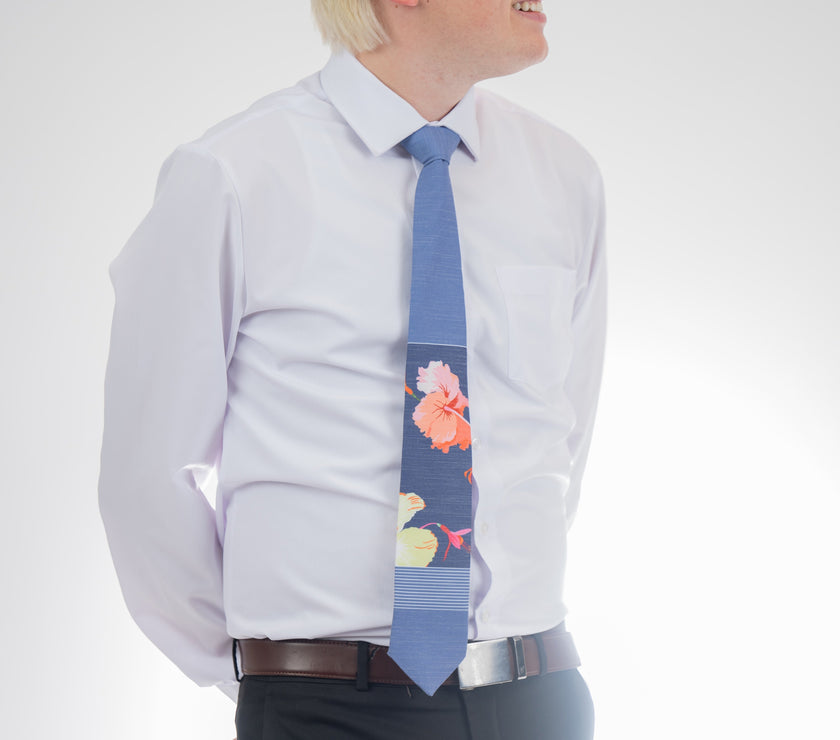 Man wearing a modern, tropical floral necktie