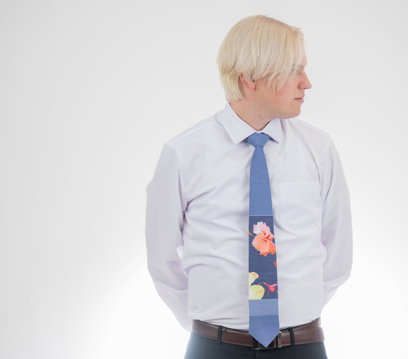 Man wearing a modern, tropical floral necktie