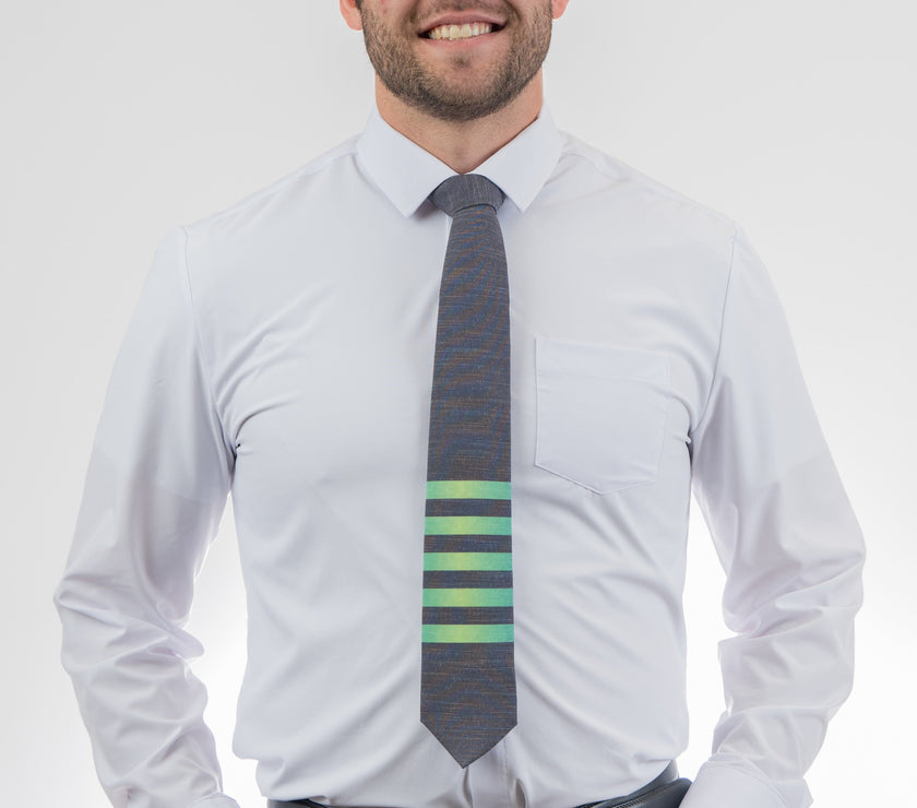 Man wearing a modern, striped necktie Tie featuring rich color and premium stitching – Kator Shop’s high-end accessory for men in Utah.