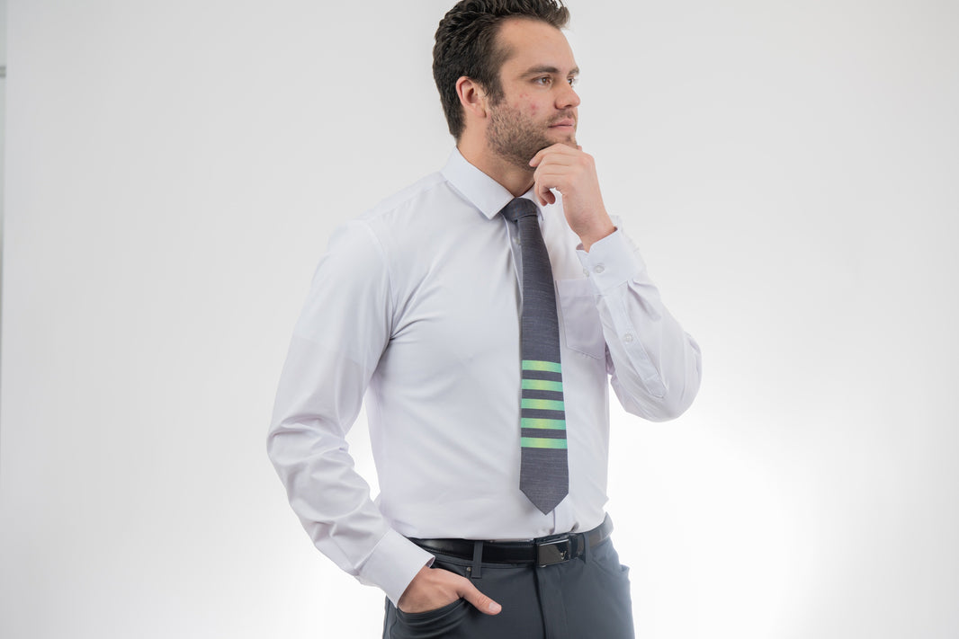 Man wearing a modern, striped necktie Tie handcrafted by Kator Shop – refined Utah menswear piece built to elevate any formal look in Cache Valley.