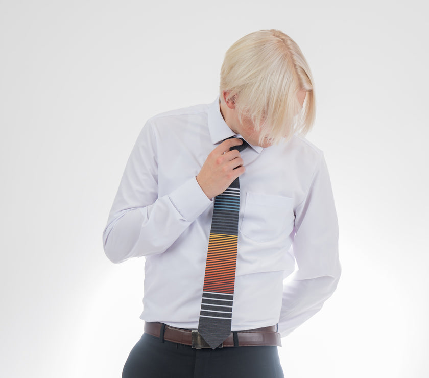 Man wearing a cool, modern, horizontal striped necktie Tie handcrafted by Kator Shop – refined Utah menswear piece built to elevate any formal look in Cache Valley.
