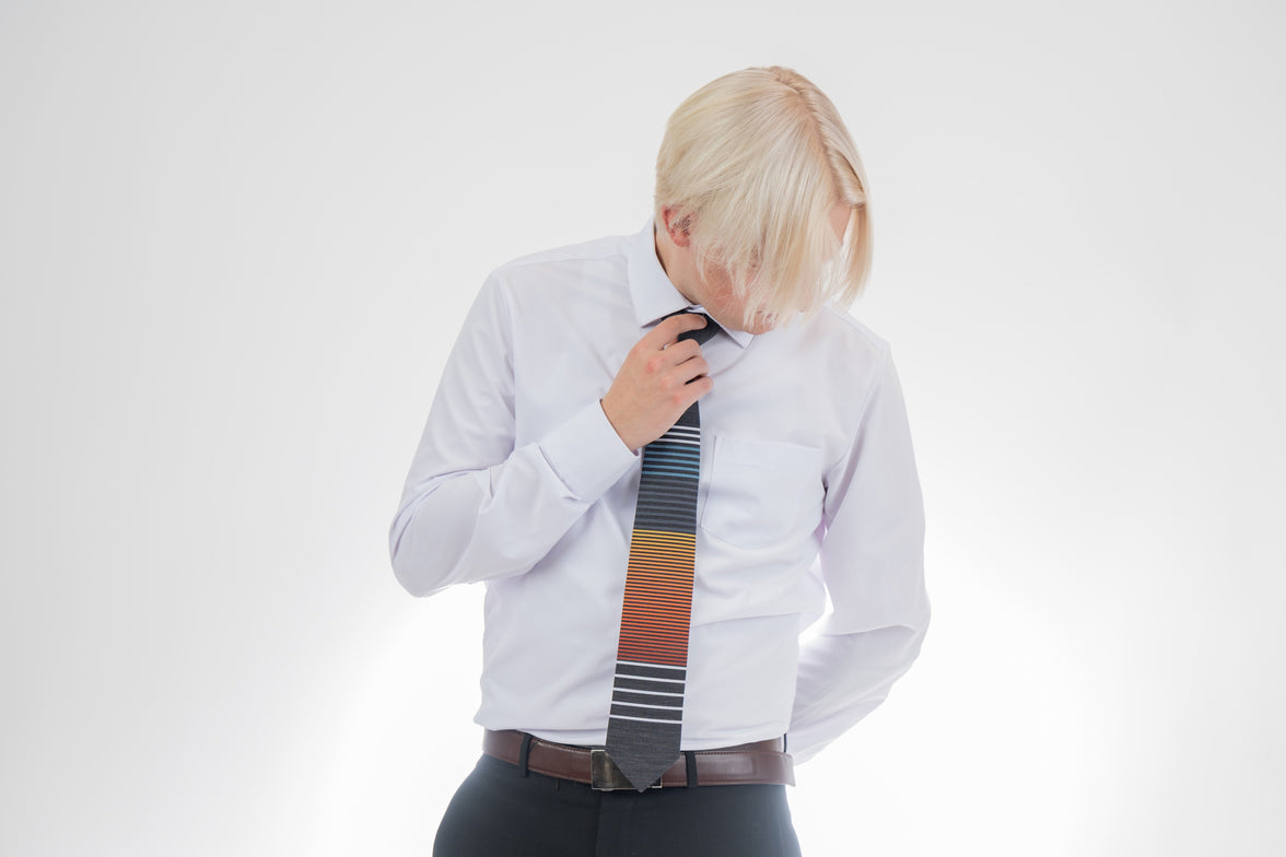 Man wearing a cool, modern, horizontal striped necktie Tie handcrafted by Kator Shop – refined Utah menswear piece built to elevate any formal look in Cache Valley.