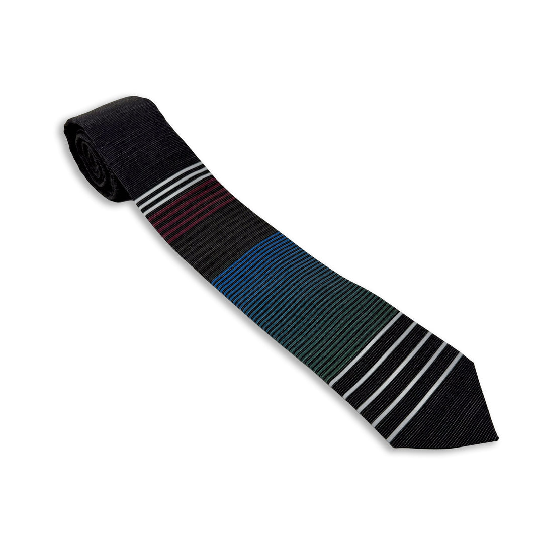 Close up photo of a men's modern, cool, striped necktie. Missionary tie built to last through daily wear — crafted in Logan, Utah by Kator Shop for elders serving around the world.