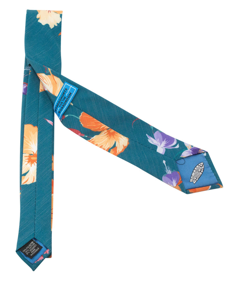A teal necktie with tropical floral pattern, Tie featuring rich color and premium stitching – Kator Shop’s high-end accessory for men in Utah.