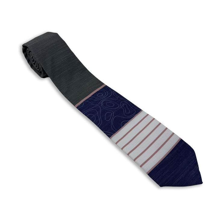 A gray, pink, and blue men's necktie with stripes and topography lines pattern