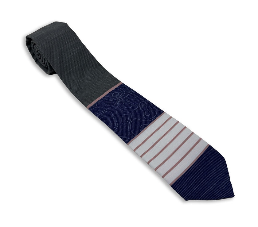 A gray, pink, and blue men's necktie with stripes and topography lines pattern