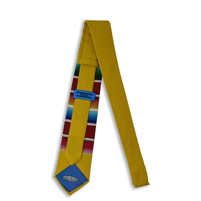 A fun, yellow necktie with multicolored stripes in the style of a Mexican blanket