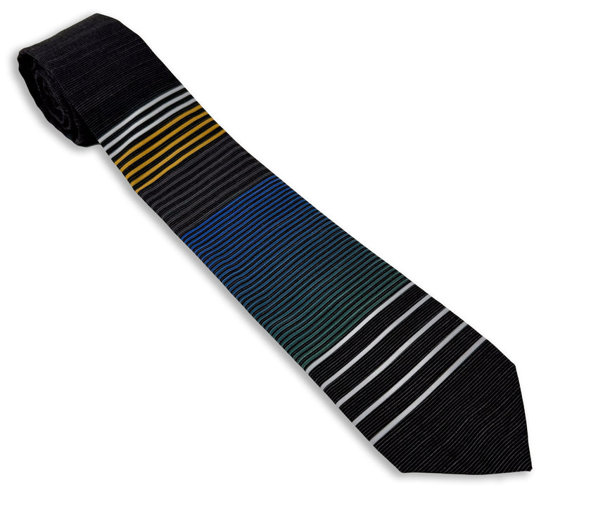 A cool, modern, striped blue and yellow necktie Tie from Kator Shop in Logan, Utah – high-quality men’s accessory made for timeless style and confidence.