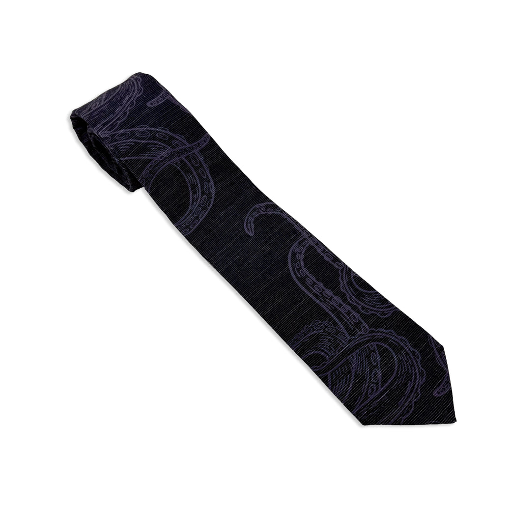 Photo of a men's necktie with an octopus on it. Elegant wedding tie from Kator Shop — designed in Utah for timeless wedding style that photographs perfectly.