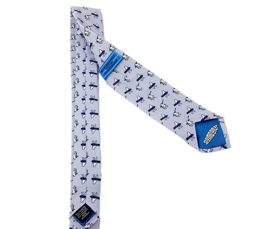 A necktie with yetis carrying skis and snowboards. Everyday tie from Kator Shop — versatile Utah menswear piece blending comfort, simplicity, and class.