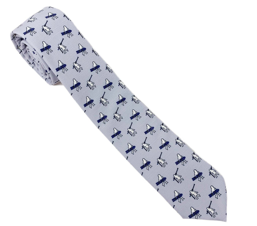 A necktie with yeti carrying skis and snowboards. Missionary tie built to last through daily wear — crafted in Logan, Utah by Kator Shop for elders serving around the world.