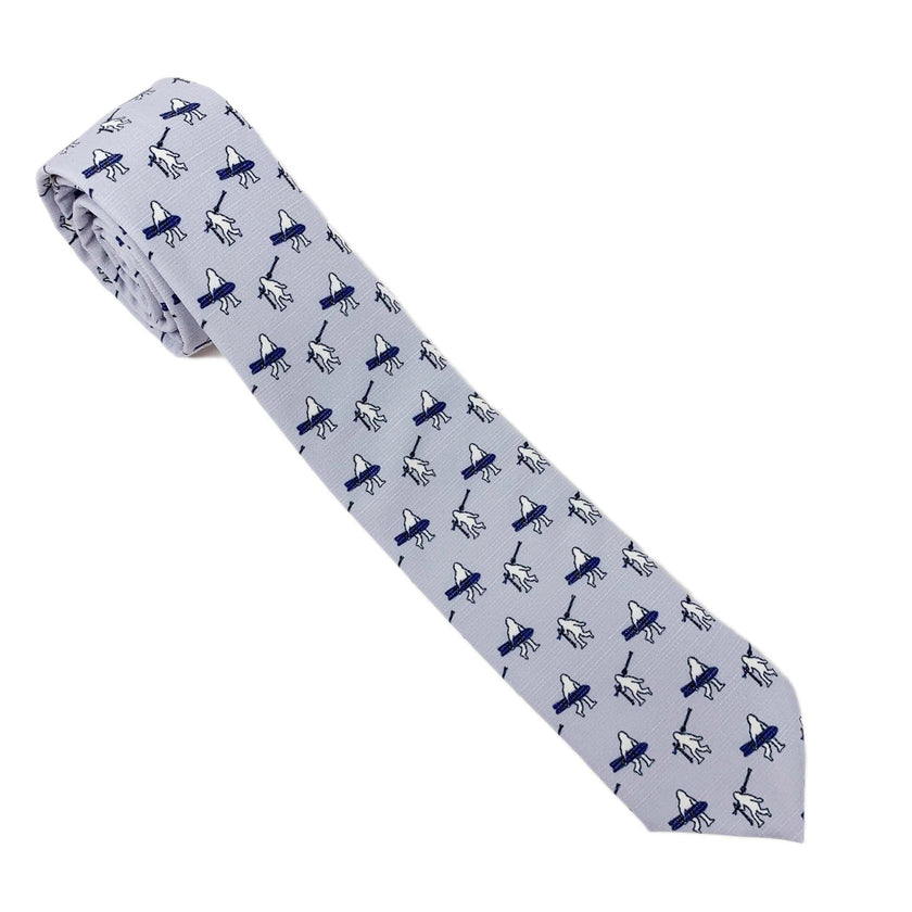 A necktie with yeti carrying skis and snowboards. Missionary tie built to last through daily wear — crafted in Logan, Utah by Kator Shop for elders serving around the world.