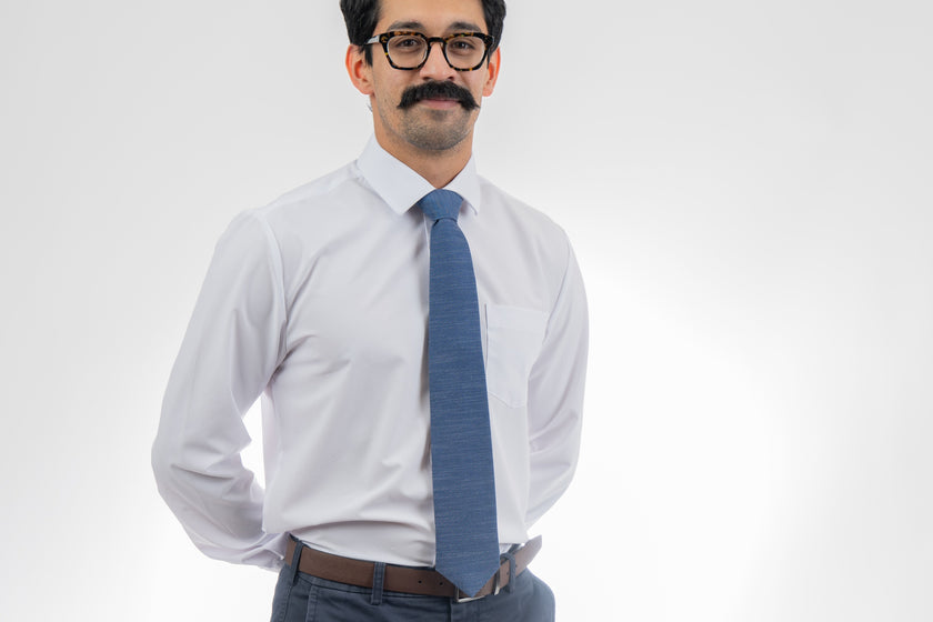 Man wearing a cool, modern, blue necktie.  Business tie from Kator Shop in Logan, Utah — premium material designed for confidence and all-day comfort at work.