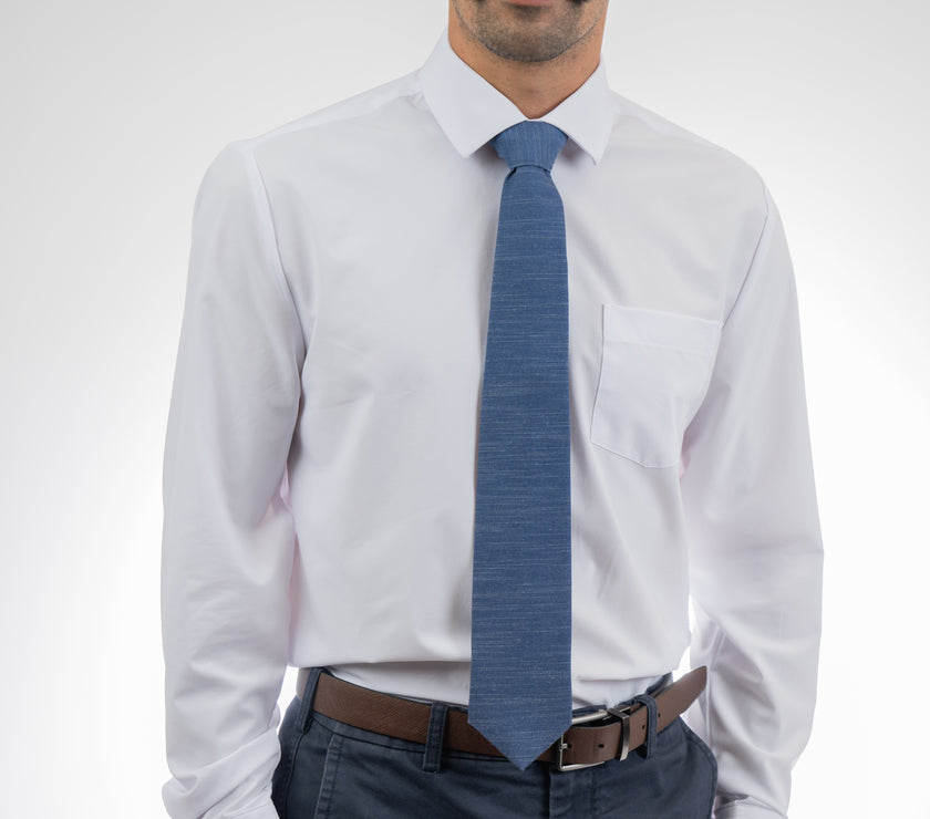 Man wearing a cool, modern, blue necktie. Sharp prom tie from Kator Shop in Logan, Utah — bold color and luxury texture for a standout prom night look.