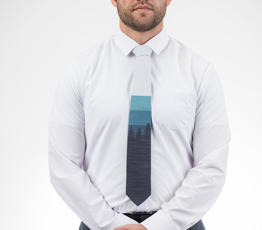 Sunrise Pines (blue-gray) Men's Tie Business tie from Kator Shop in Logan, Utah — premium material designed for confidence and all-day comfort at work.